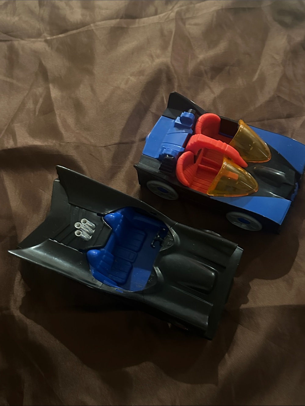 Batmobiles- a Mego Batmobile (1980s) and a Fisher Price Imaginex- DC comics